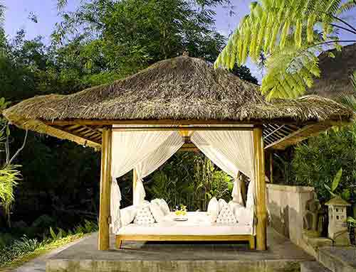Bamboo gazebo with thatched roof and white sheeting by buying agent in Indonesia from Bali sourcing.