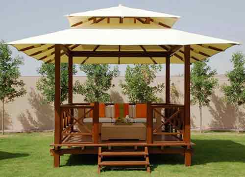 Exotic wooden gazebo with two canvas roofs, by buying agent in Bali for sourcing and export from Indonesia.